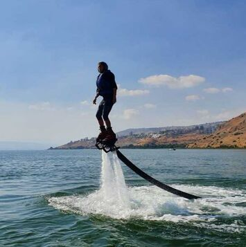 Flyboarding water activity on the Sea of Galilee Kinneret, Tiberias, Israel