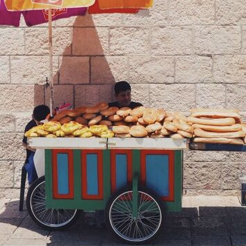Middle Eastern bread vendor in old Jerusalem city center