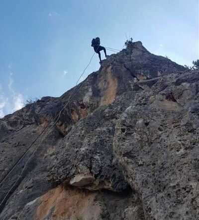 Rappelling rock climbing on mountain cliff in the Golan Heights Northern Israel